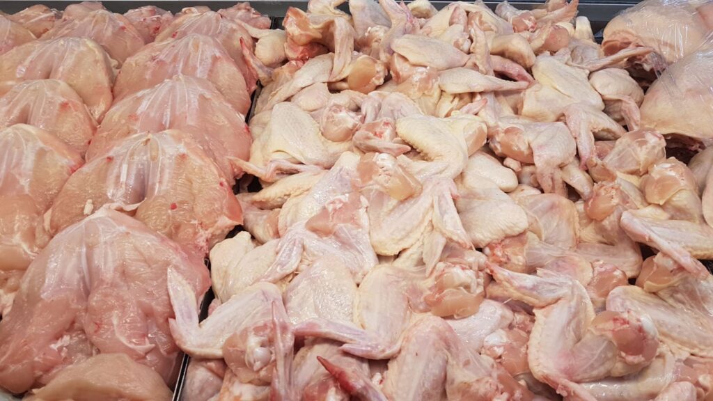 Raw chicken pieces on a tray before air fryer cooking