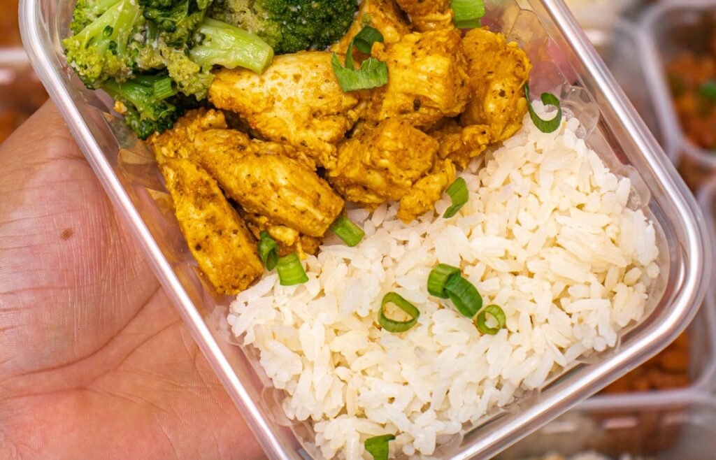 Meal prep container with chicken rice and broccoli