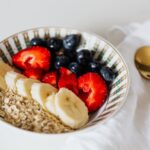 Oatmeal bowl with banana strawberries and blueberries