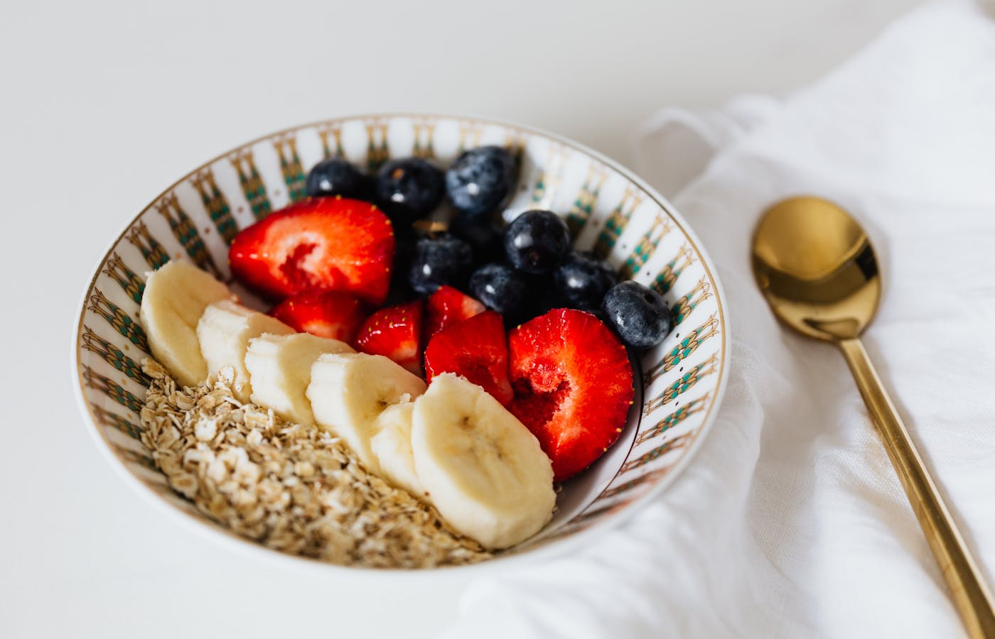 Oatmeal bowl with banana strawberries and blueberries