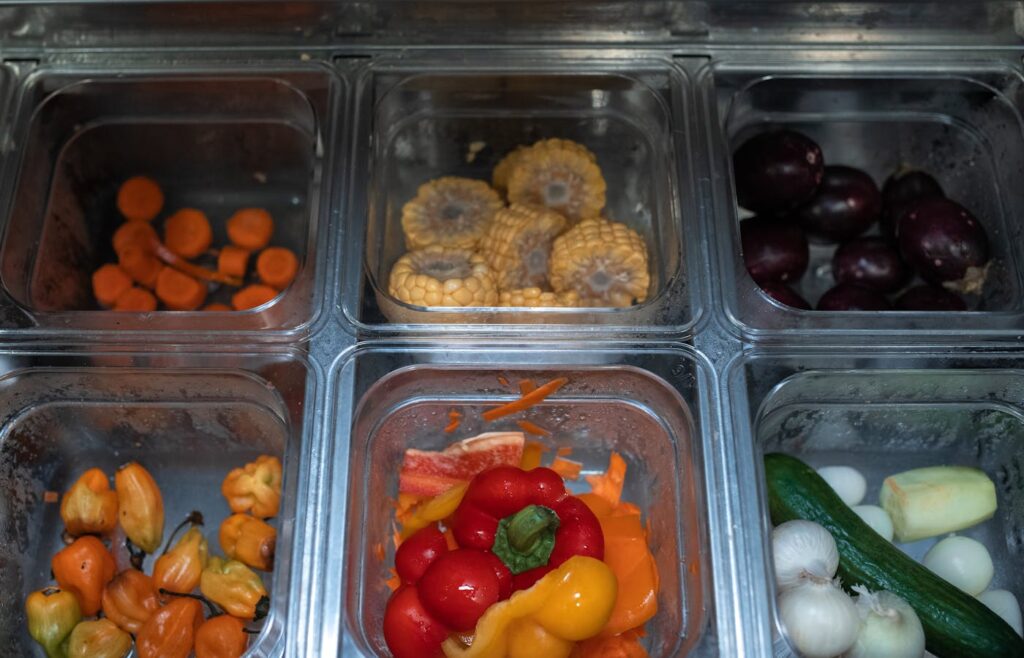 Vegetables stored in clear kitchen containers