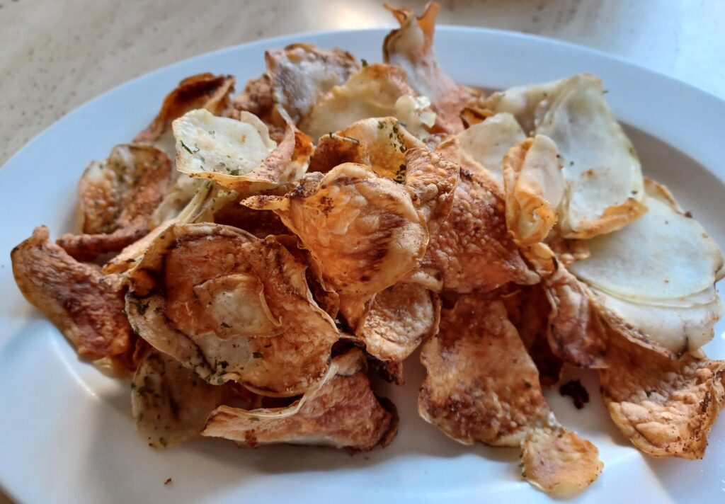 Air fryer dinner with air fried potato chips on a table