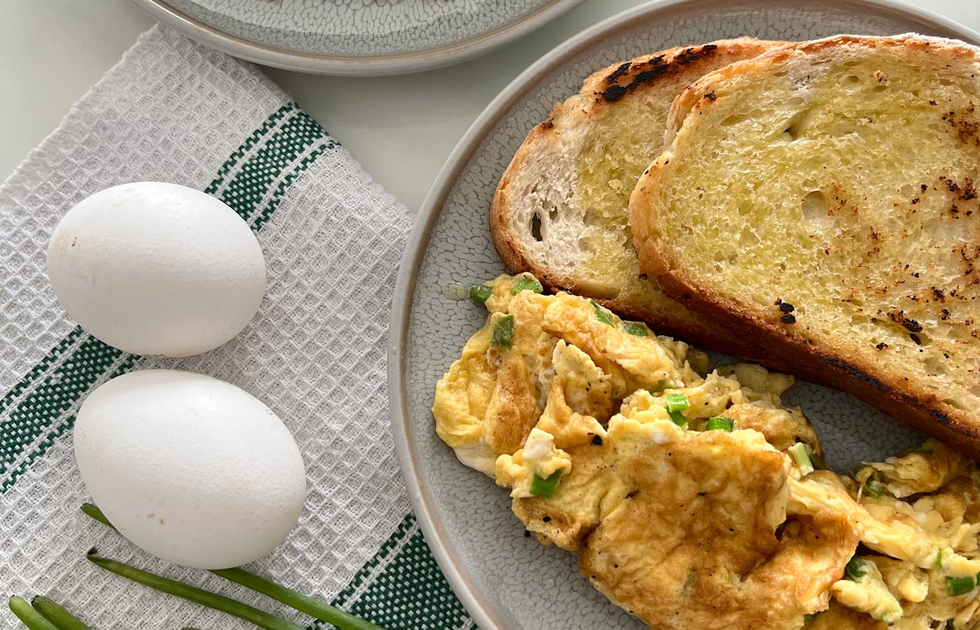 Scrambled eggs with toast on a breakfast plate